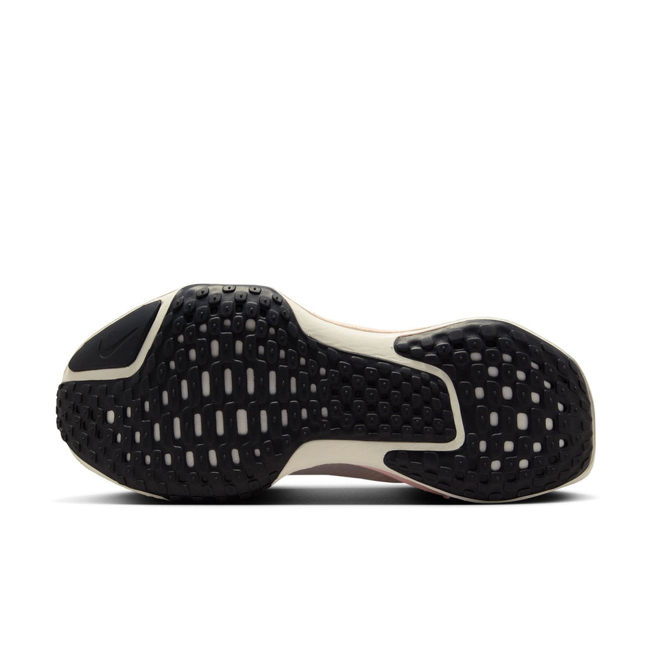 The outsole on the left shoe from a pair of Nike Women's Invincible 3 Road Running Shoes in the White/Black-Atmosphere-Blue Tint colourway. (8615483375778)