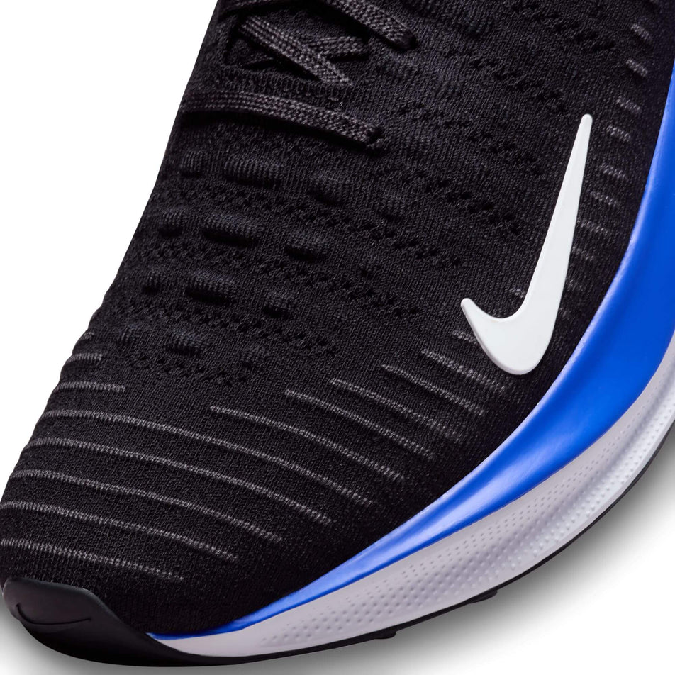 Lateral side of the toe box on the left shoe from a pair of Nike Men's Infinity RN 4 Road Running Shoes in the Black/White-Anthracite-Racer Blue colourway (7979473436834)