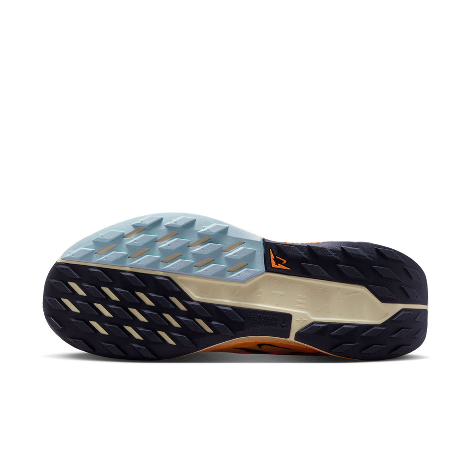 The outsole of the left shoe from a pair of Nike Men's Pegasus Trail 5 Trail Running Shoes in the Orange Pulse/Black-Ghost-Alabaster colourway. (8754907578530)
