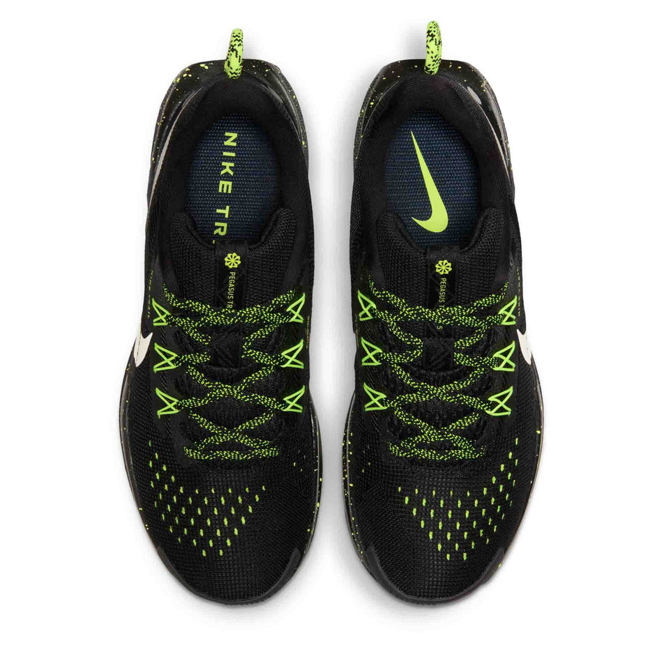 The uppers of a pair of Nike Women's Pegasus Trail 5 Running Shoes in the Black/Phantom-Volt Ice colourway.