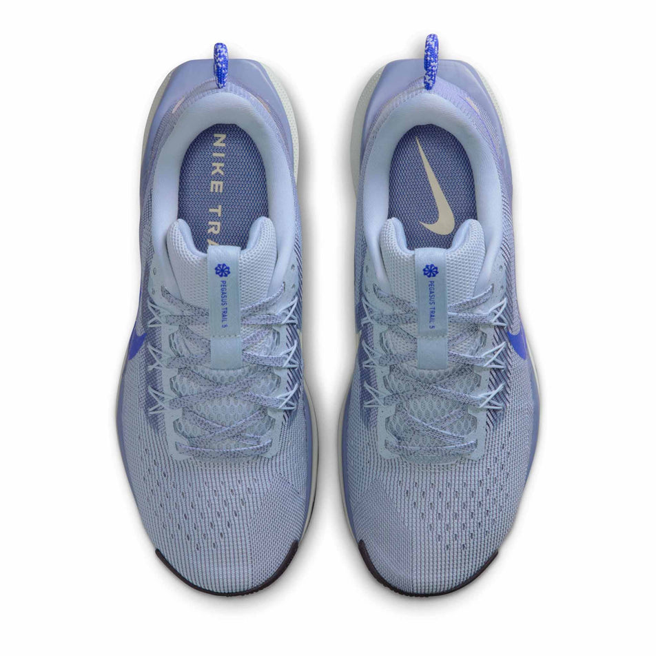 The uppers of a pair of Nike Women's Pegasus Trail 5 Trail Running Shoes in the Light Armory Blue/Racer Blue-World Indigo colourway. (8756168294562)