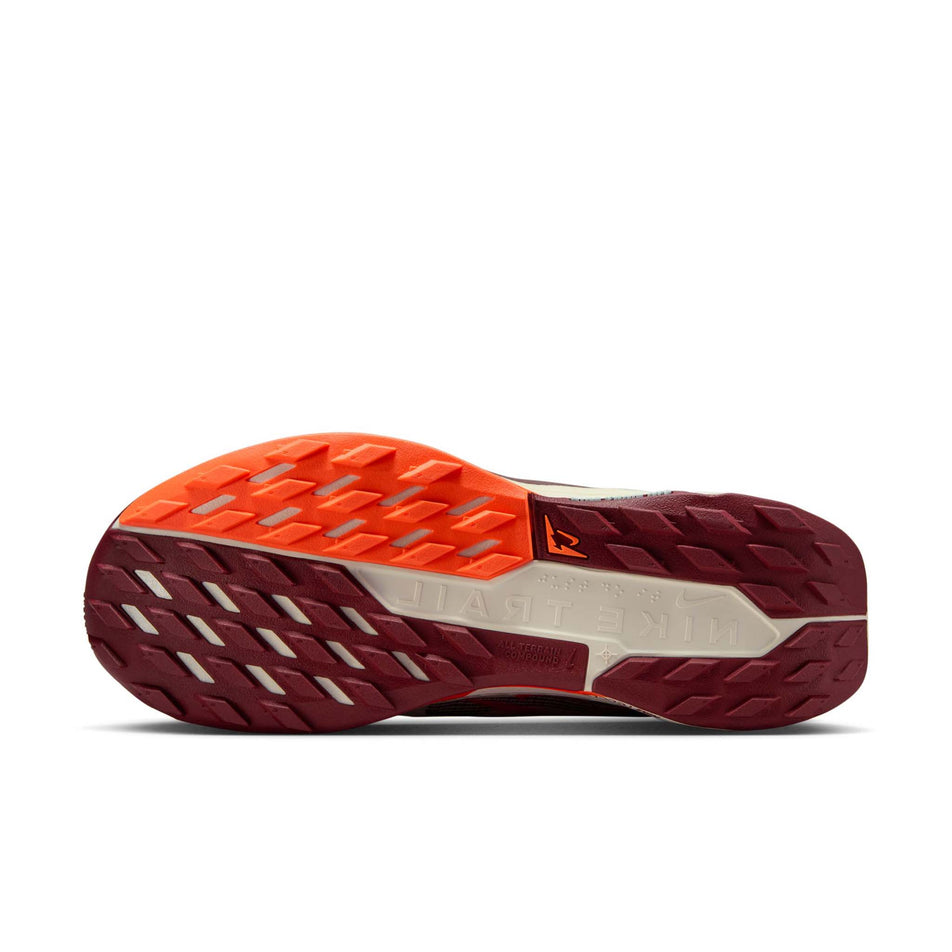 The outsole of the left shoe from a pair of Nike Women's Pegasus Trail 5 Running Shoes in the Silt Red/Dark Team Red-Hyper Crimson colourway. (8686796079266)