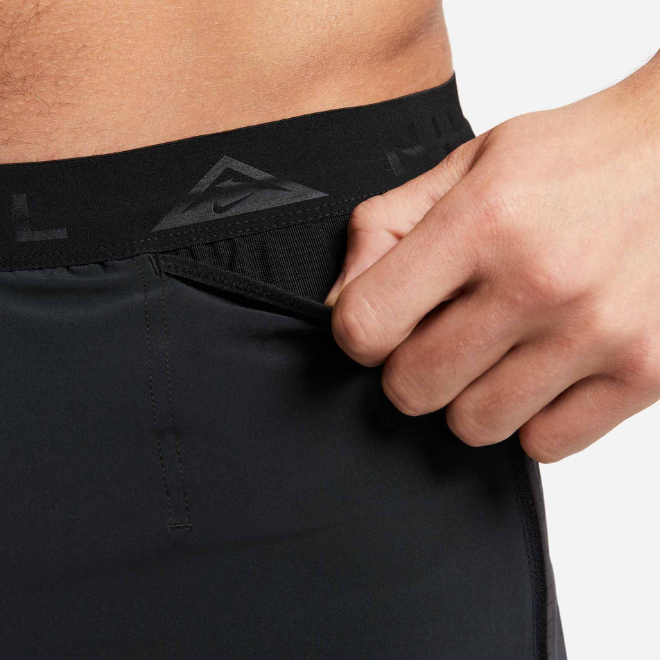 Close-up of the drop-in pocket on the front-left side of Nike Men's Dri-FIT Trail Second Sunrise 5