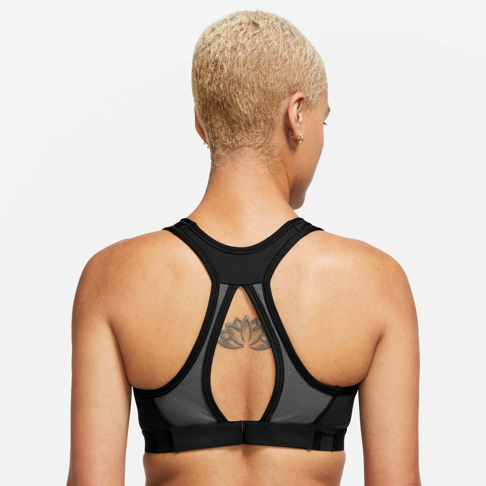 Back view of a model wearing a Nike Women's Swoosh High Support Non-Padded Adjustable Bra in the Black/Iron Grey/White colourway (7980204916898)