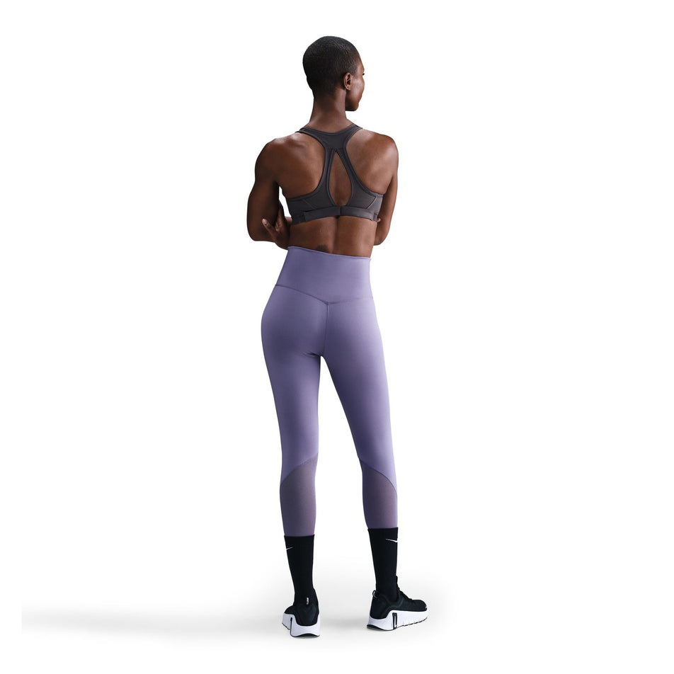 Back view of a model wearing the Nike Women's Swoosh High Support Non-Padded Adjustable Bra in the Thunder Grey colourway. (8692875165858)