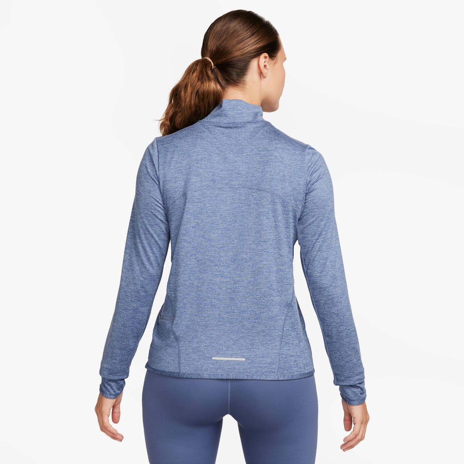 Back view of a model wearing a Nike Women's Dri-FIT Swift Element UV 1/4-Zip Running Top in the Ashen Slate/Reflective Silv colourway (8059808710818)