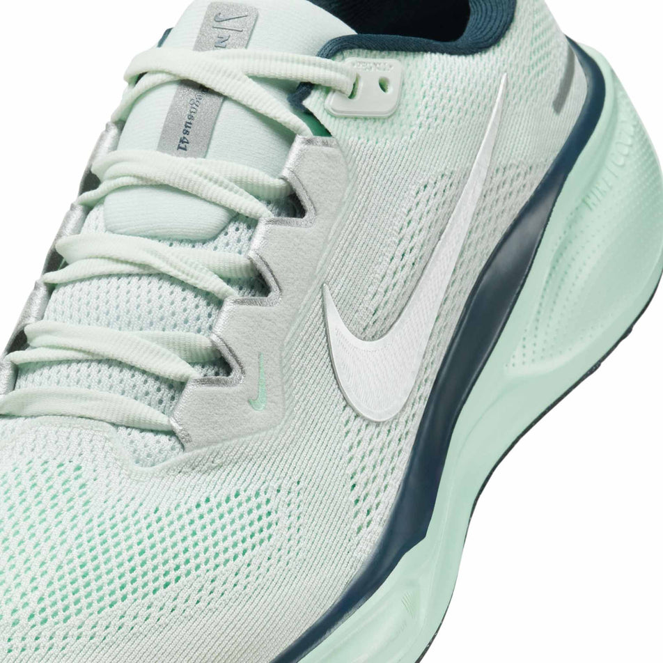 Close up of the upper of the left shoe from a pair of Nike Women's Pegasus 41 Road Running Shoes in the Ghost Aqua/Metallic Silver-Mint Foam colourway. (8686784610466)