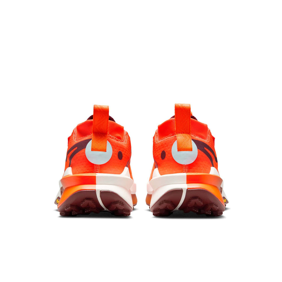 The back of a pair of Nike Women's Zegama Trail 2 Trail Running Shoes in the Hyper Crimson/Dark Team Res-Glacier Blue colourway. (8725423882402)