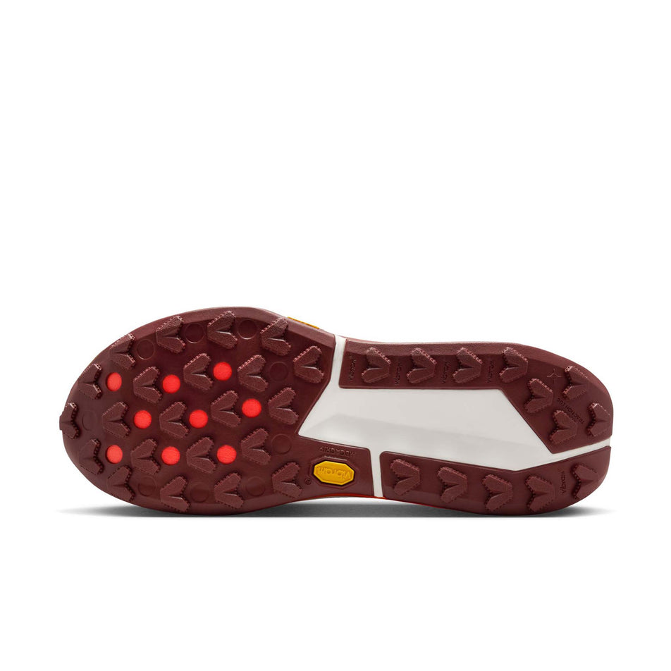 The outsole of the left shoe from a pair of Nike Women's Zegama Trail 2 Trail Running Shoes in the Hyper Crimson/Dark Team Res-Glacier Blue colourway. (8725423882402)