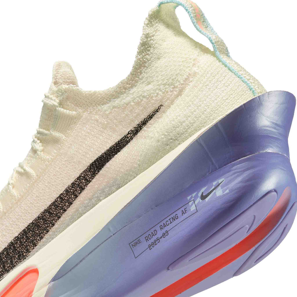 Close up of the midsole of the left shoe from a pair of Nike Women's Alphafly 3 Road Racing Shoes in the Coconut Milk/Off Noir-Dusty Amethyst colourway. (8614530875554)