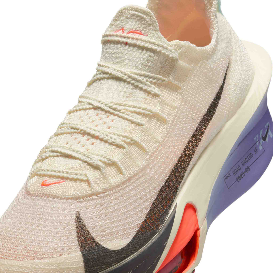 Close up of the upper of the left shoe from a pair of Nike Women's Alphafly 3 Road Racing Shoes in the Coconut Milk/Off Noir-Dusty Amethyst colourway. (8614530875554)