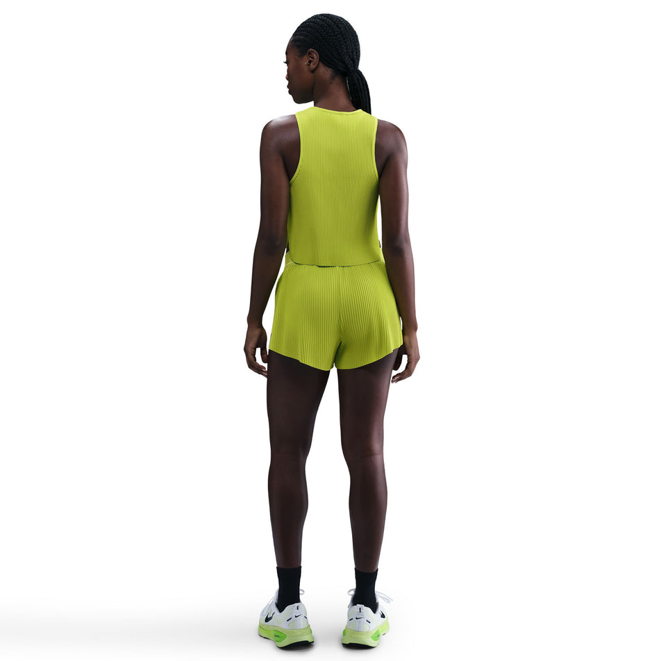 Back view of a model wearing the Nike Women's AeroSwift Dri-FIT ADV Mid-Rise Brief-Lined 3
