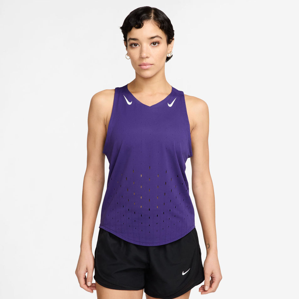 Front view of a model wearing the Nike Women's AeroSwift Dri-FIT ADV Running Singlet in the Court Purple/White colourway. (8692840792226)