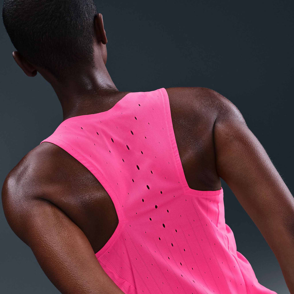 Back view of a model wearing the Nike Women's AeroSwift Dri-FIT ADV Running Singlet in the Hyper Pink/Black colourway. (8692847444130)