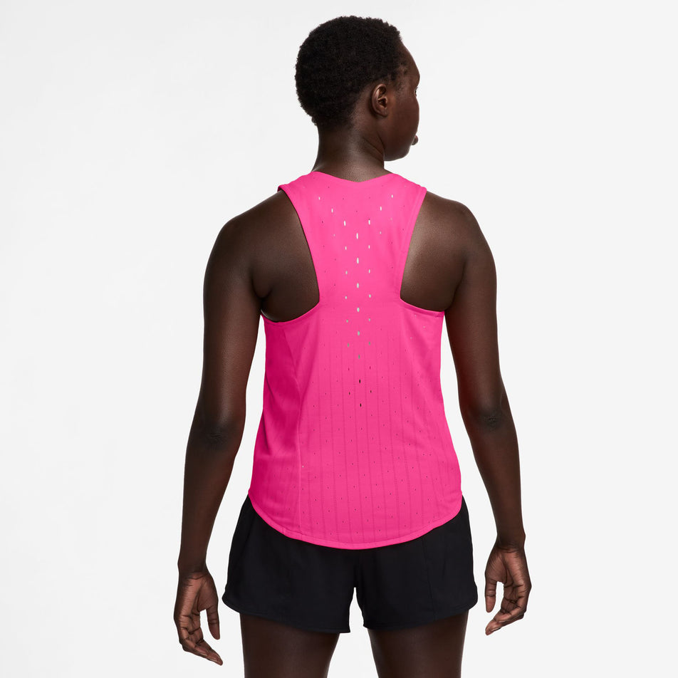 Back view of a model wearing the Nike Women's AeroSwift Dri-FIT ADV Running Singlet in the Hyper Pink/Black colourway. (8692847444130)