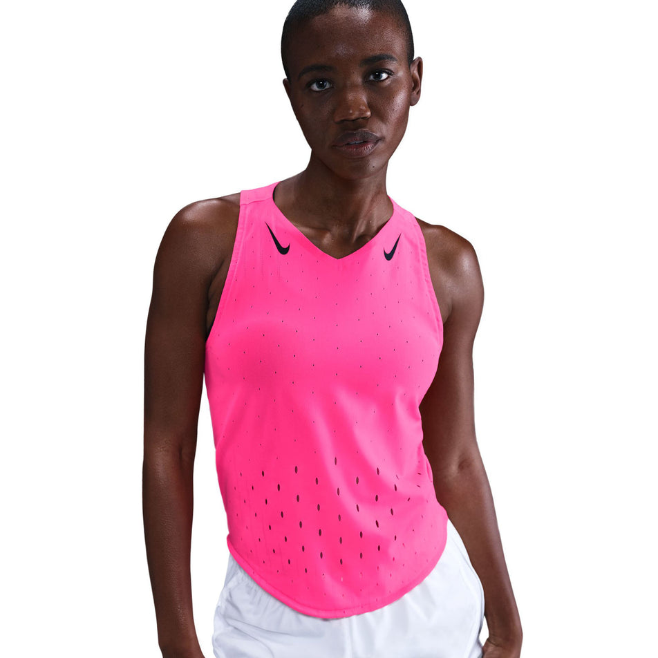 Front view of a model wearing the Nike Women's AeroSwift Dri-FIT ADV Running Singlet in the Hyper Pink/Black colourway. (8692847444130)