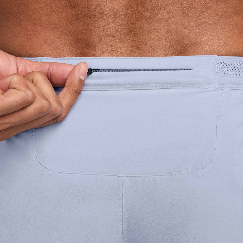 Close up of the zippered pocket on the back of the Nike Men's AeroSwift Dri-FIT ADV 4