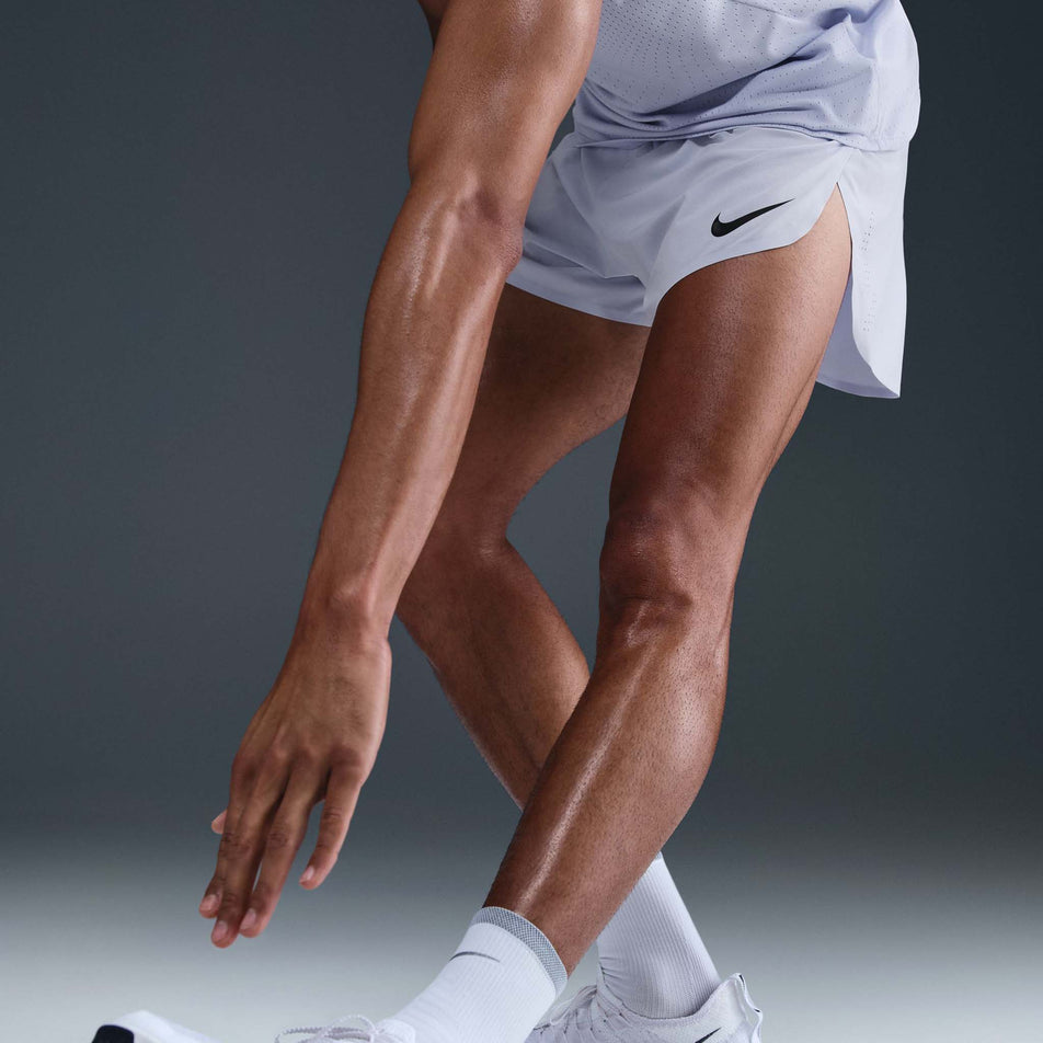 Front view of a model wearing the Nike Men's AeroSwift Dri-FIT ADV 4