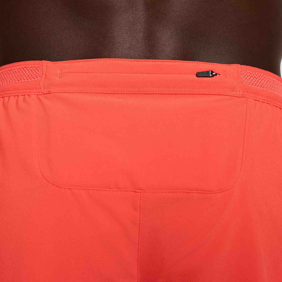 Close-up view of the zip pocket on the back of the Nike Men's AeroSwift Dri-FIT ADV 4
