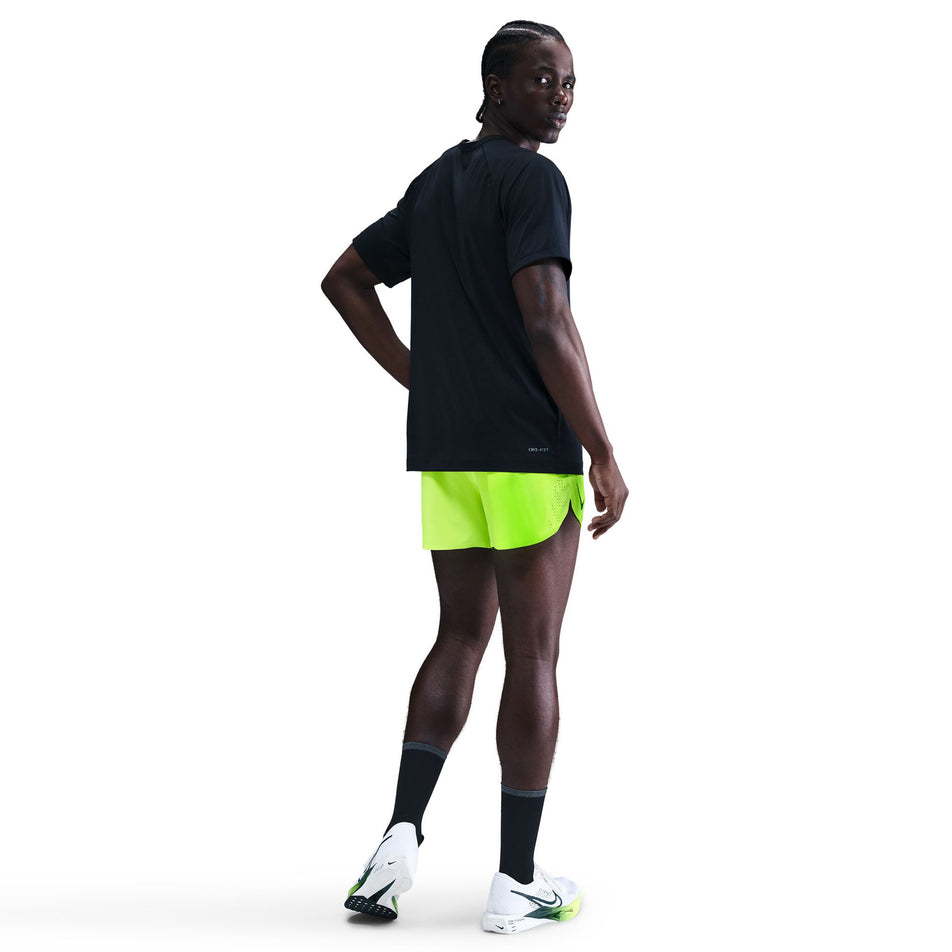 Back view of a model wearing the Nike Men's AeroSwift Dri-FIT ADV 4