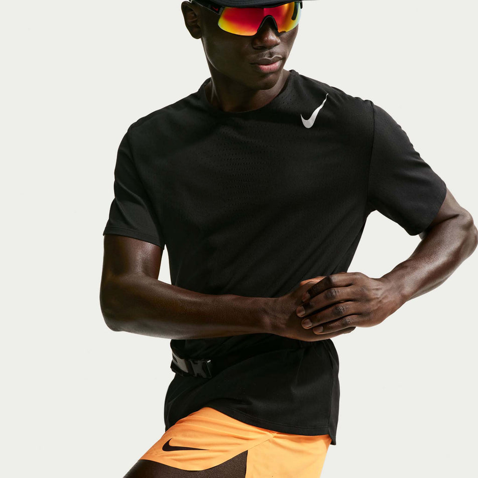 Angled view of a model wearing the Nike Men's AeroSwift Dri-FIT ADV 4