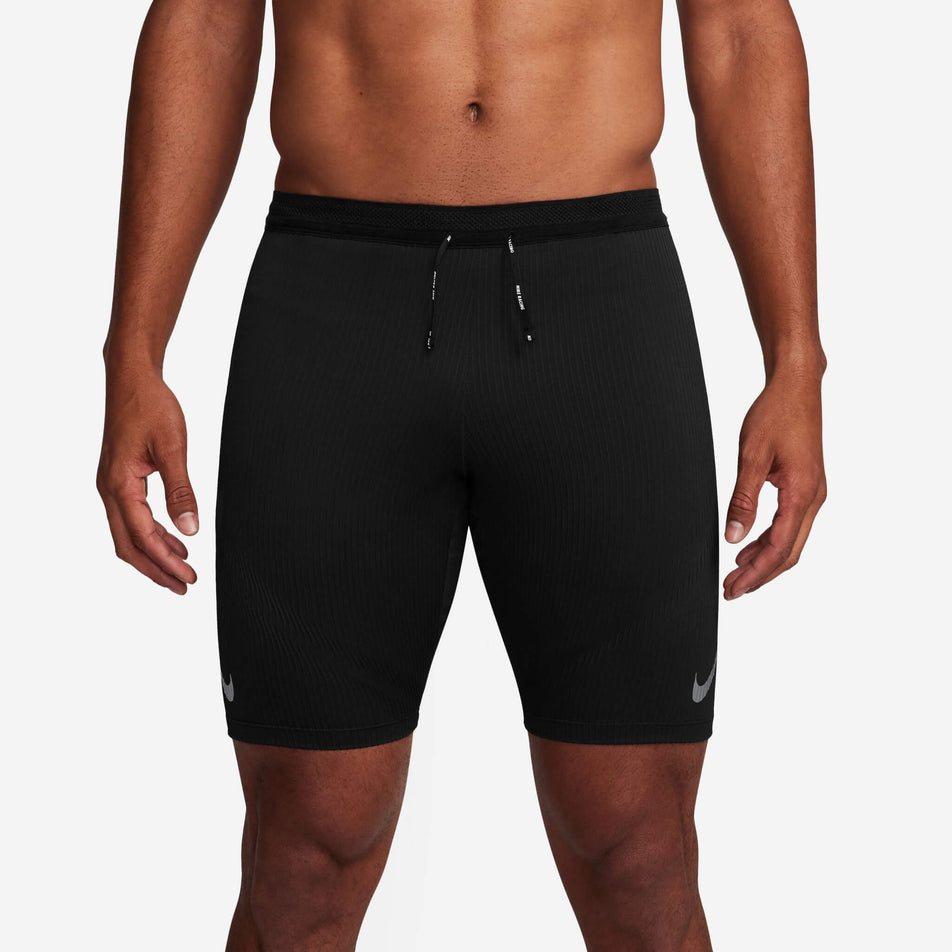 Front view of a model wearing a pair of Nike Men's AeroSwift Dri-FIT ADV Running 1/2-Length Tights in the Black/Summit White colourway (8140202803362)
