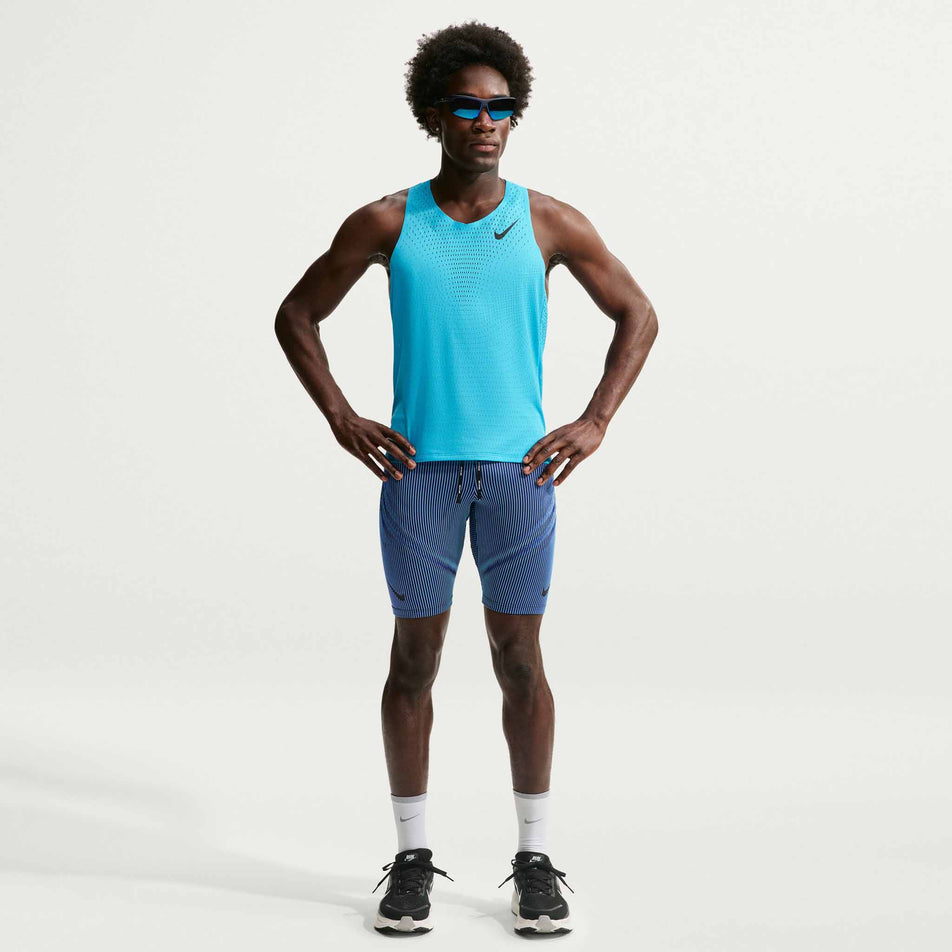 Front view of a model wearing the Nike Men's AeroSwift Dri-FIT ADV Running 1/2-Length Tights in the Baltic Blue/Black/Old Royal Black colourway.