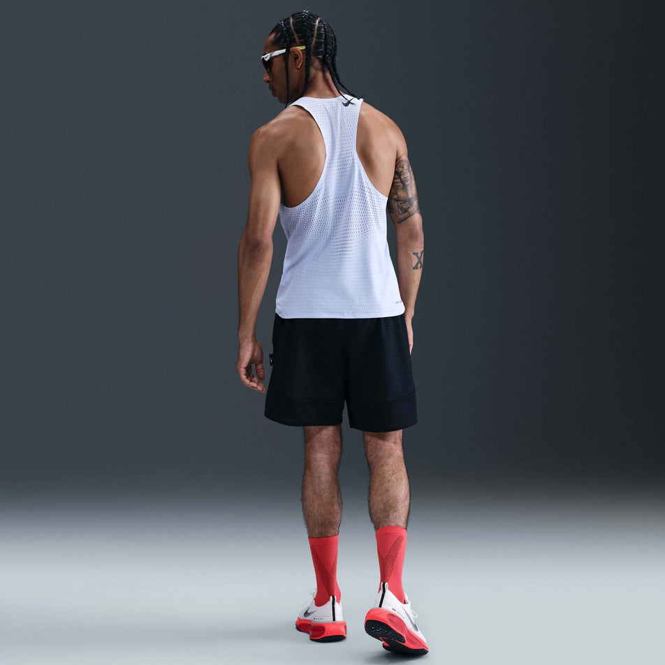 Back view of a model wearing the Nike Men's AeroSwift Dri-FIT ADV Running Singlet in the Ghost/Black colourway. (8710799949986)