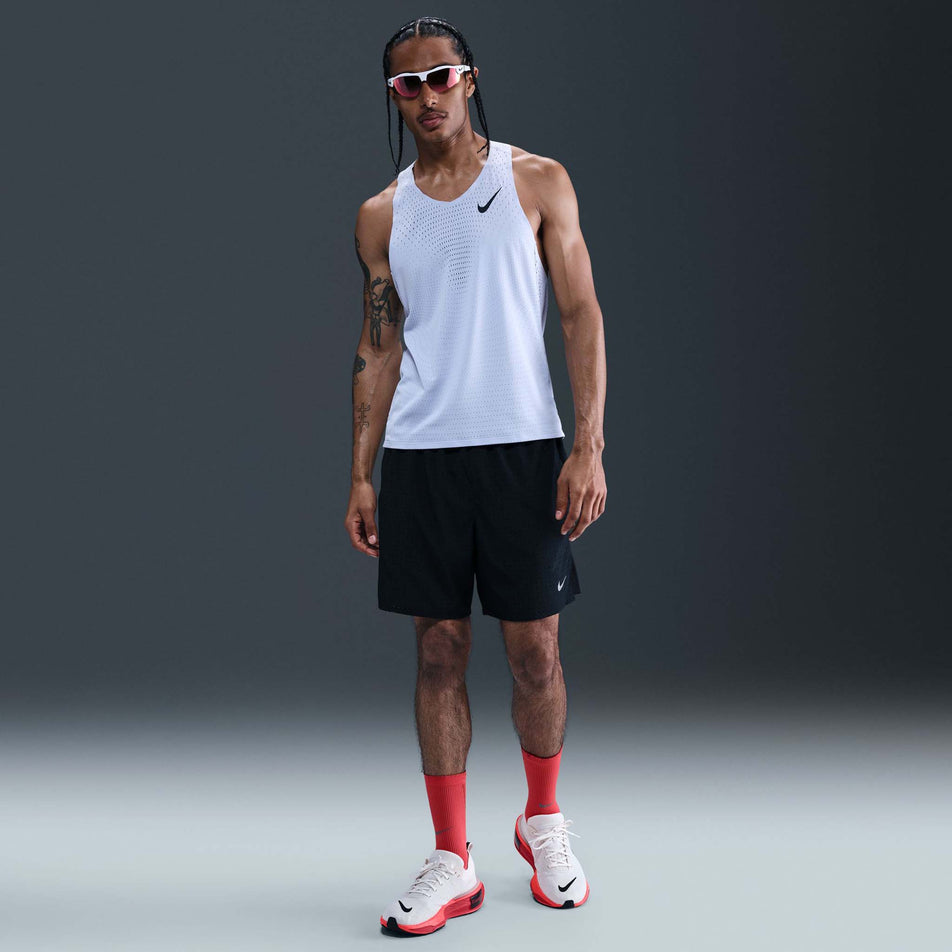 Front view of a model wearing the Nike Men's AeroSwift Dri-FIT ADV Running Singlet in the Ghost/Black colourway. (8710799949986)
