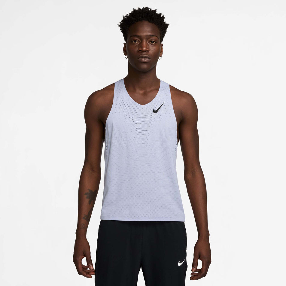 Front view of a model wearing the Nike Men's AeroSwift Dri-FIT ADV Running Singlet in the Ghost/Black colourway. (8710799949986)