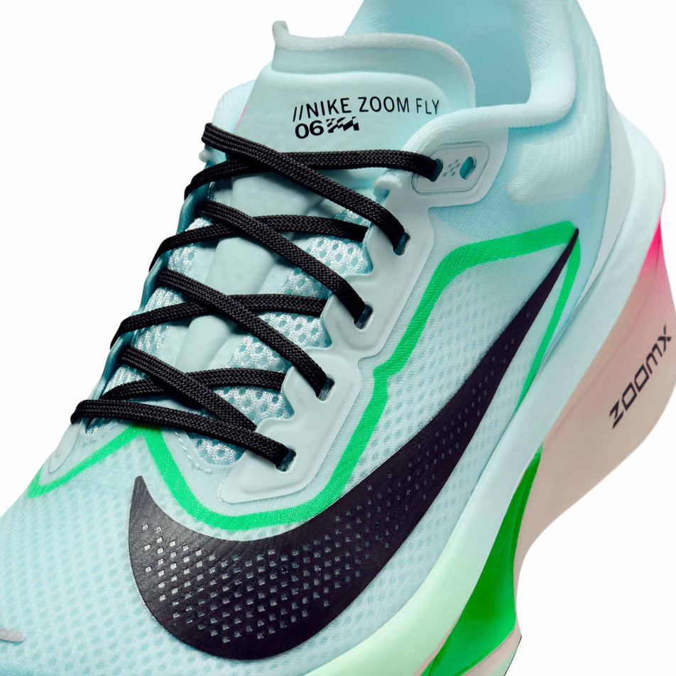 Close up of the upper of the left shoe from a pair of Nike Women's Zoom Fly 6 Road Running Shoes in the Glacier Ice/Black-Hyper Pink-Green Shock colourway. (8684678250658)
