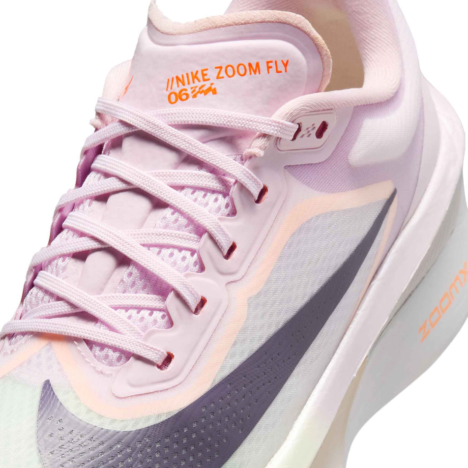 Close-up view of the upper of the left shoe from a pair of Nike Women's Zoom Fly 6 Road Running Shoes in the Bleached Lilac/Purple Dynasty-Volt Tint colourway.