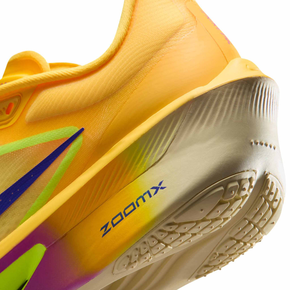 Close-up view of the rearfoot section of the left shoe from a pair of Nike Women's Zoom Fly 6 Road Running Shoes in the Citron Pulse/Indigo Burst-Volt Ice colourway.