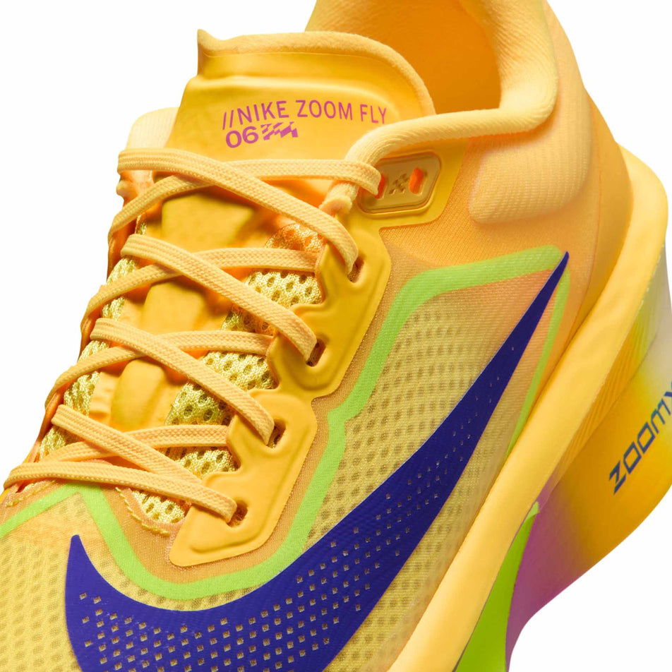 Close-up view of the upper of the left shoe from a pair of Nike Women's Zoom Fly 6 Road Running Shoes in the Citron Pulse/Indigo Burst-Volt Ice colourway.