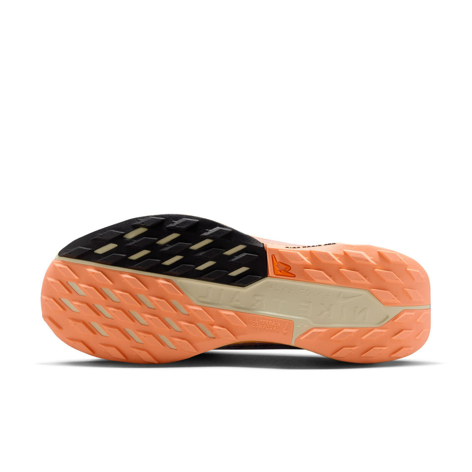 The outsole of the left shoe from a pair of Nike Women's Pegasus Trail 5 GORE-TEX Waterproof Trail Running Shoes in the Ghost/Black-Malt-Orange Pulse colourway. (8756166131874)