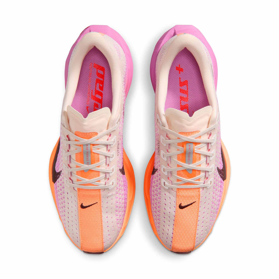 The uppers of a pair of Nike Women's Pegasus Plus Road Running Shoes in the Chalk/Tattoo-Light Magenta-Bright Crimson colourway.