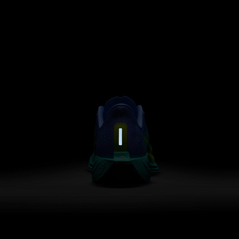 The reflectivity on the back of a shoe from a pair of Nike Women's Pegasus Plus Road Running Shoes in the Royal Pulse/Cyber-Green Frostblack colourway. (8503177937058)