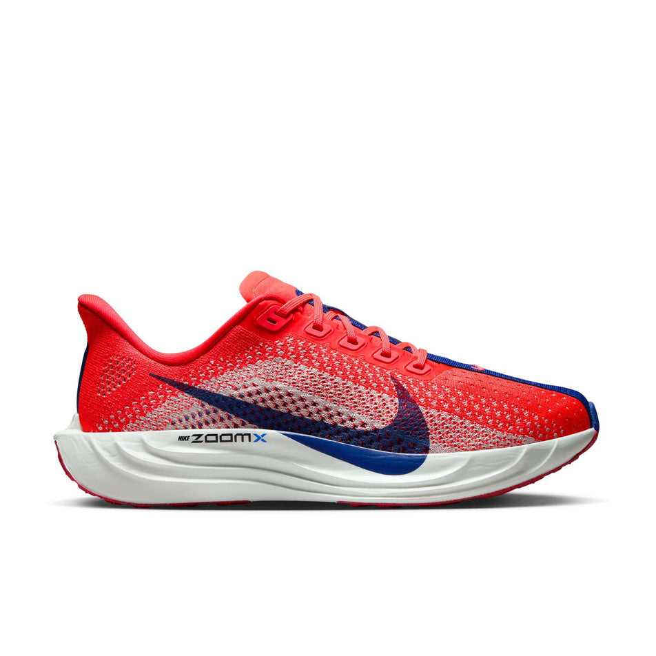Lateral view of the right shoe from a pair of Nike Women's Pegasus Plus Road Running Shoes in the Bright Crimson/Deep Royal Blue-Silt colourway. (8686778581154)