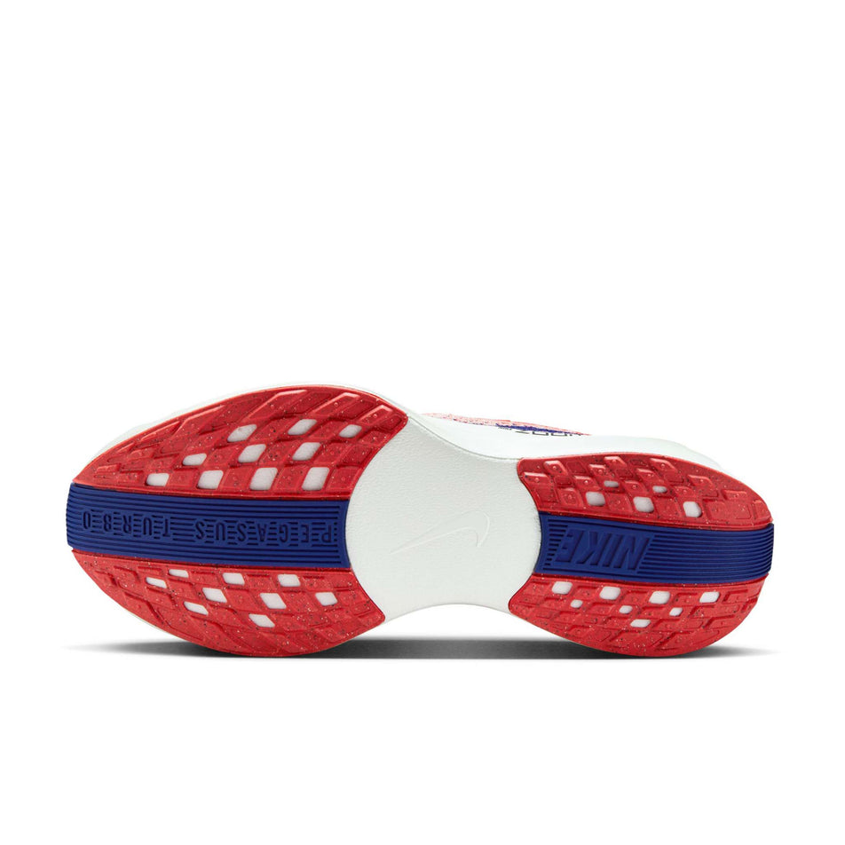 The outsole of the left shoe from a pair of Nike Women's Pegasus Plus Road Running Shoes in the Bright Crimson/Deep Royal Blue-Silt colourway. (8686778581154)