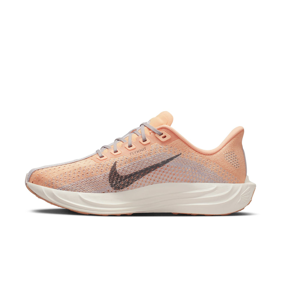 Medial view of the right shoe from a pair of Nike Women's Pegasus Plus Road Running Shoes in the Orange Chalk/Cave Stone-Platinum Violet colourway.