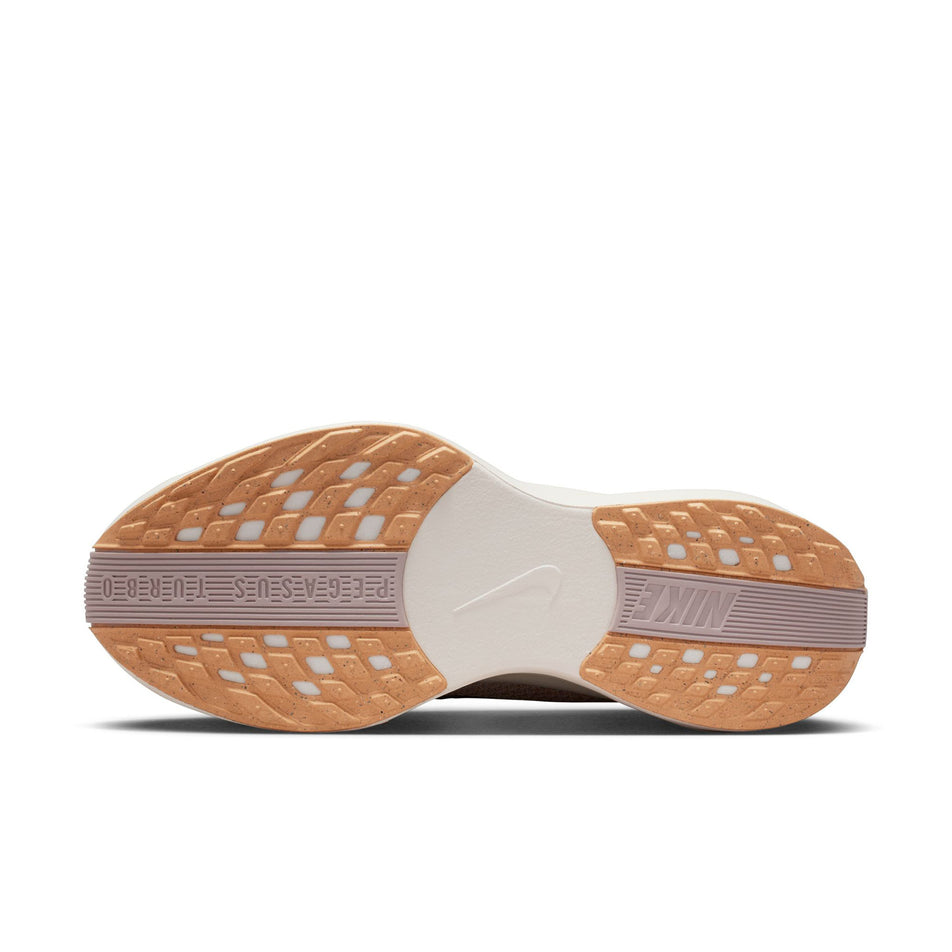 The outsole of the left shoe from a pair of Nike Women's Pegasus Plus Road Running Shoes in the Orange Chalk/Cave Stone-Platinum Violet colourway.