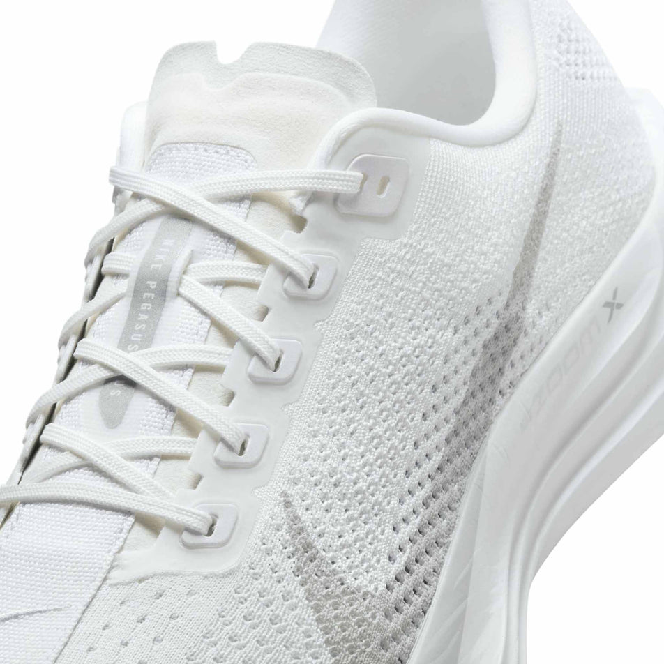 Close up of the upper of the left shoe from a pair of Nike Men's Pegasus Plus Road Running Shoes in the White/Pure Platinum-Wolf Grey colourway. (8683735351458)