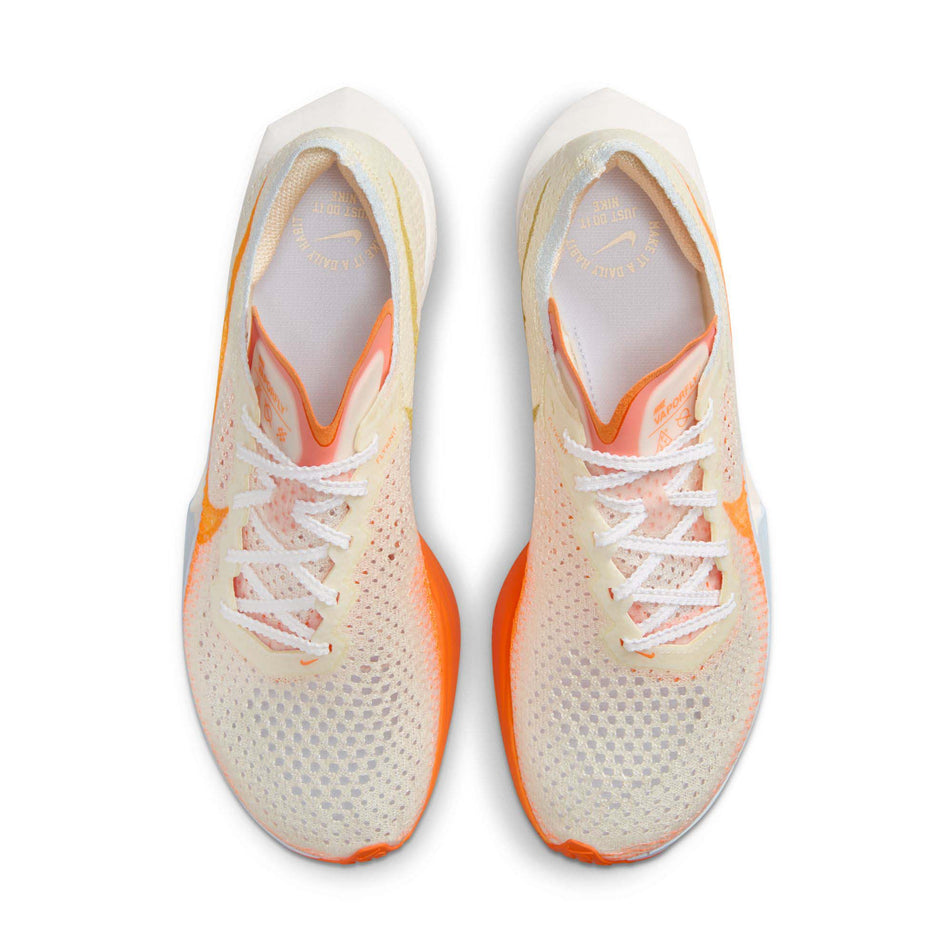 The uppers on a pair of Nike Women's Vaporfly 3 Road Racing Shoes in the Coconut Milk/Bright Mandarin-Sail colourway (8281187680418)