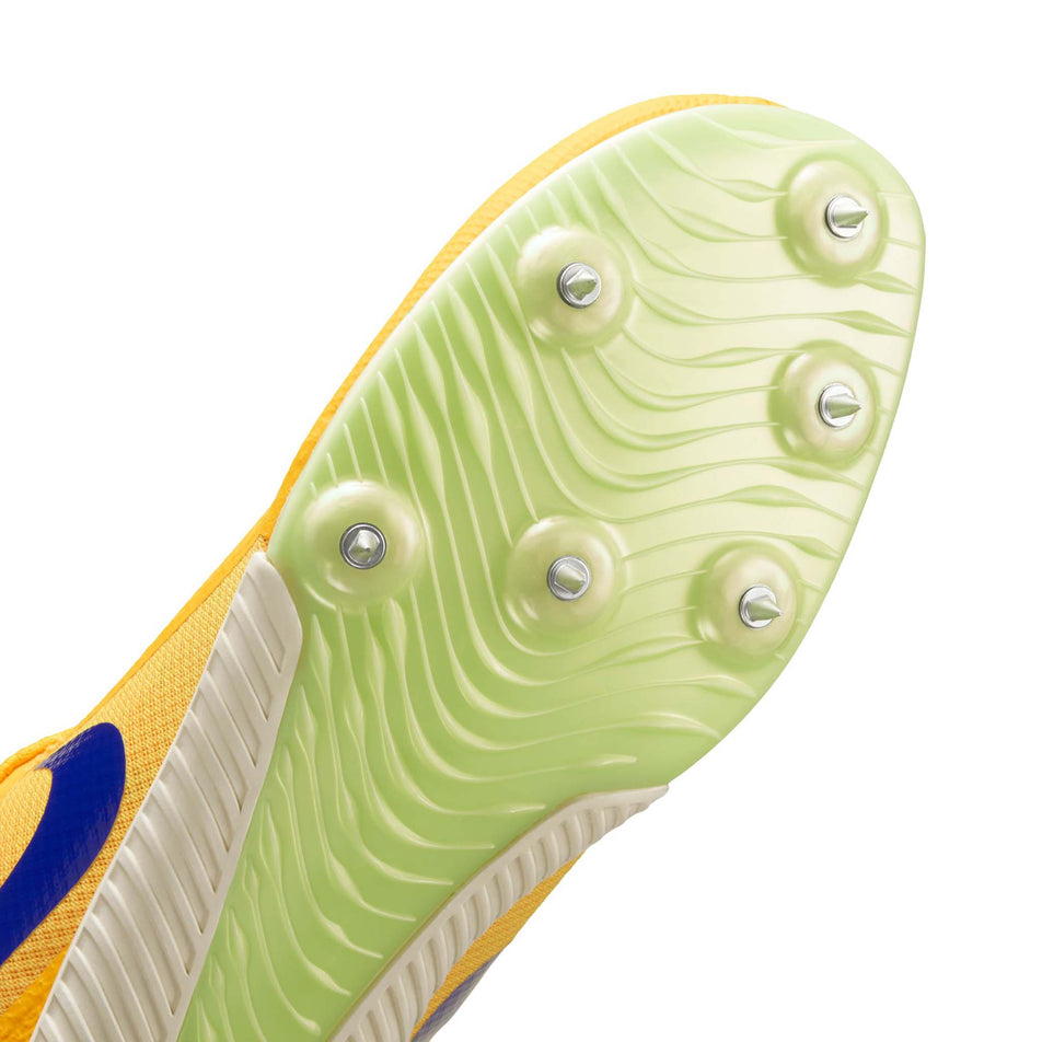 The spike plate of the left shoe from a pair of Nike Unisex Zoom Rival Track & Field Multi-Event Spikes in the Citron Pulse/Indigo Burst-Volt Glow colourway.