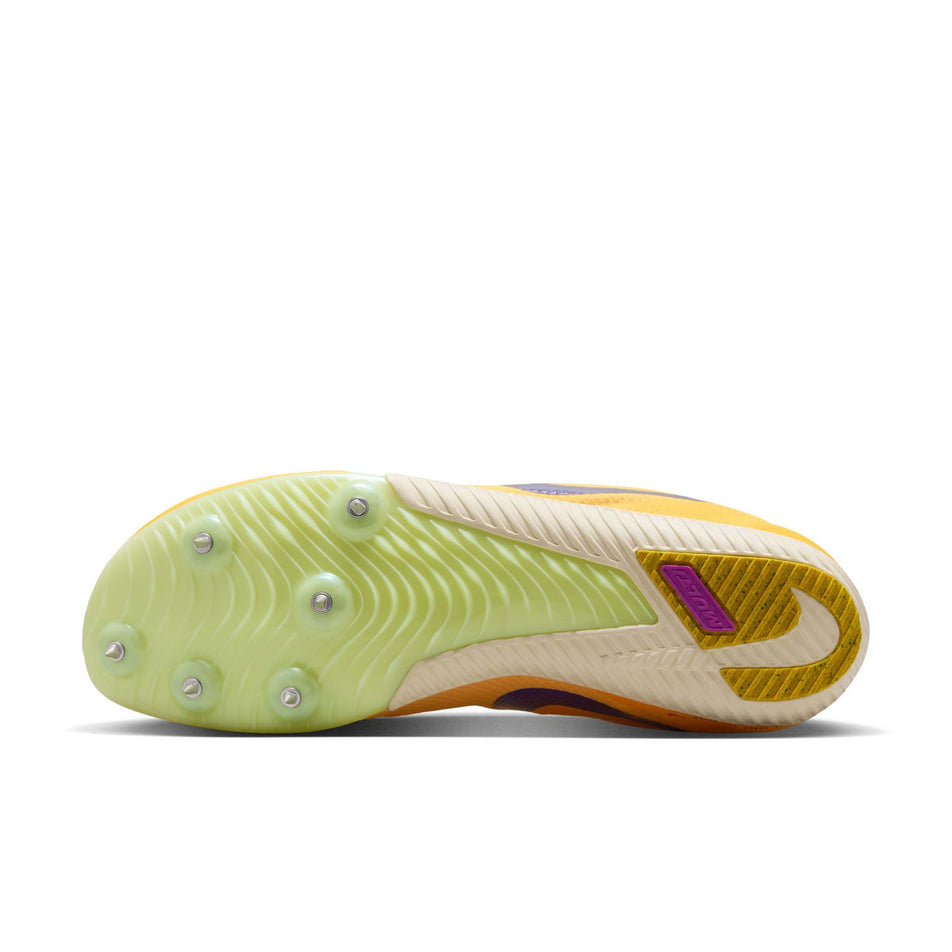 The outsole of the left shoe from a pair of Nike Unisex Zoom Rival Track & Field Multi-Event Spikes in the Citron Pulse/Indigo Burst-Volt Glow colourway.