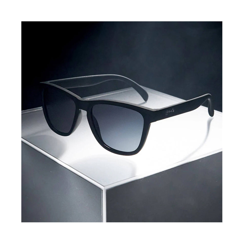 A pair of goodr OG Running Sunglasses in the A Unicorn's Calamity style. Glasses are sitting on a flat surface.