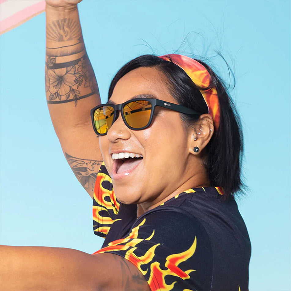 A model wearing goodr Whiskey Shots with Satan - OG - Running Sunglasses