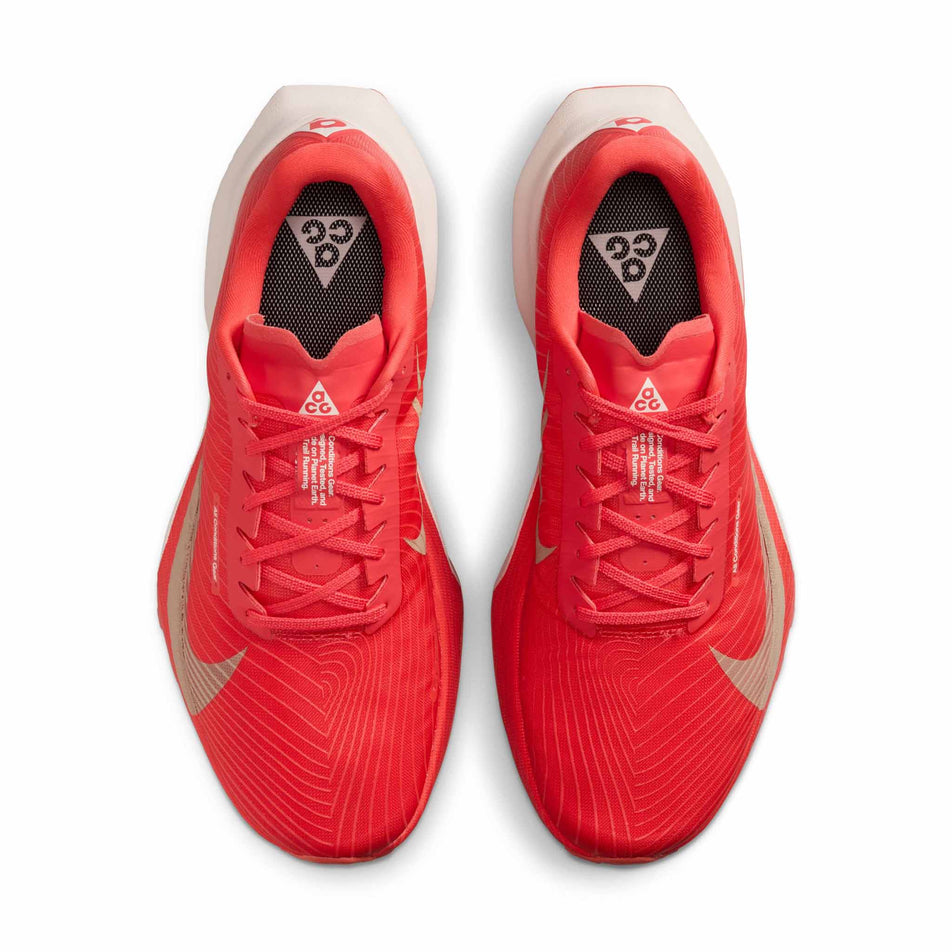 The uppers of a pair of Nike Unisex ACG Ultrafly Trail Racing Shoes in the Light Crimson/Pure Platinum-Summit White colourway.