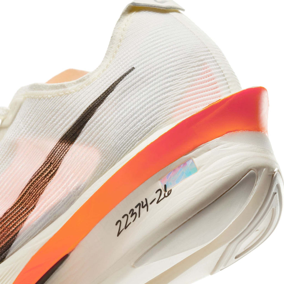 Close up of the wear-tester number on the lateral side of the left shoe from a pair of Nike Women's Vaporfly 4 Proto Road Racing Shoes in the Sail/Black-Total Orange-White colourway. (8635888500898)