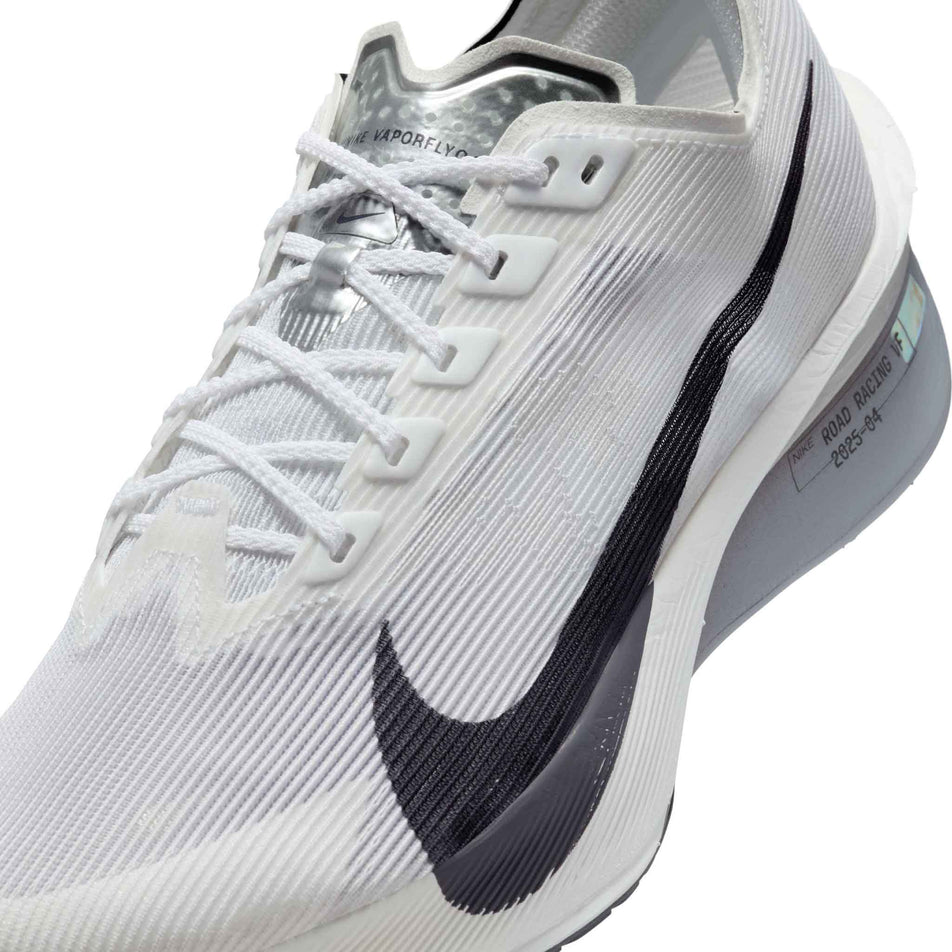 Close up of the upper on the left shoe from a pair of Nike Women's Vaporfly 4 Road Racing Shoes in the White/Gridiron-Obsidian Mist colourway. (8614572720290)